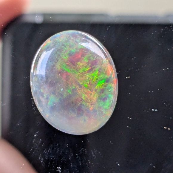 5.85ct Natural play of color black opal - Picture 15 of 16